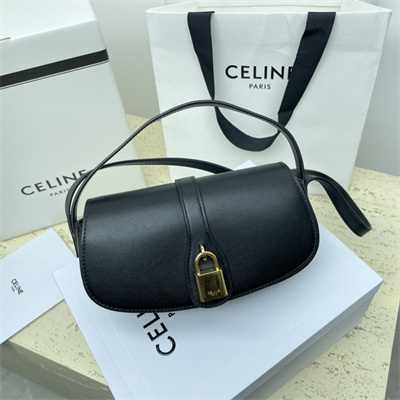 Ce**e clutch on strap tabou in smooth calfskin black