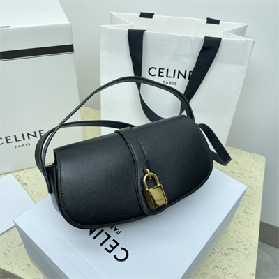 Ce**e clutch on strap tabou in smooth calfskin black