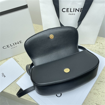 Ce**e clutch on strap tabou in smooth calfskin black