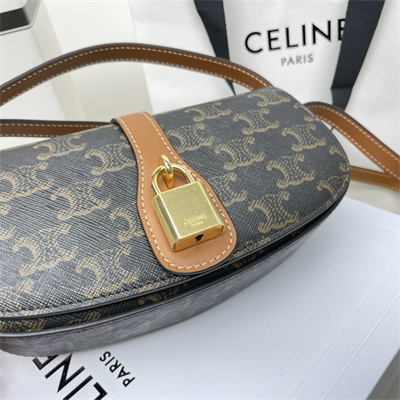 Ce**e clutch on strap tabou in triomphe canvas and calfskin tan