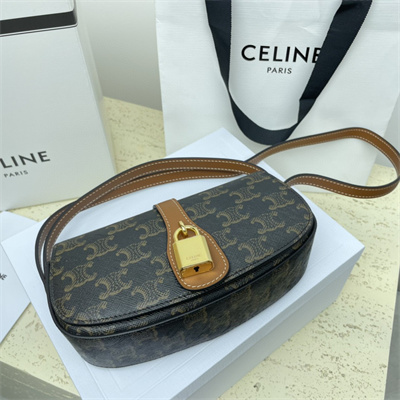 Ce**e clutch on strap tabou in triomphe canvas and calfskin tan