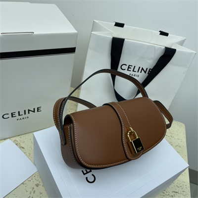 Ce**e clutch on strap tabou in smooth calfskin tan