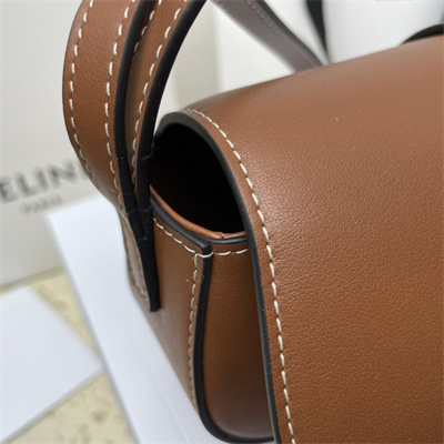 Ce**e clutch on strap tabou in smooth calfskin tan