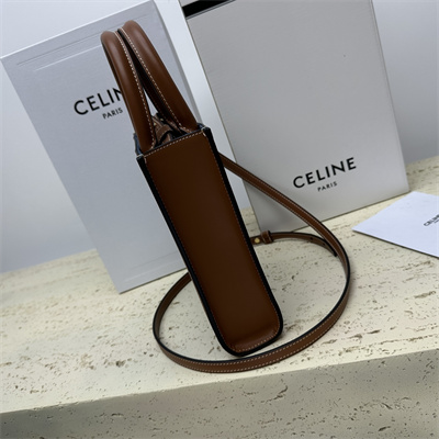 Ce**e mini vertical cabas in denim with Ce**e all over print navy/tan