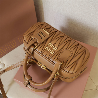 M*um*u arcadie matelassé nappa leather top handle bag caramel color