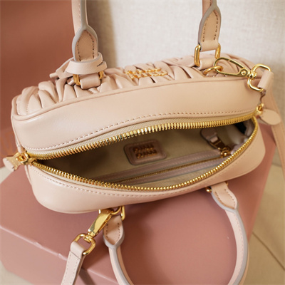 M*um*u arcadie matelassé nappa leather top handle bag pale pink color